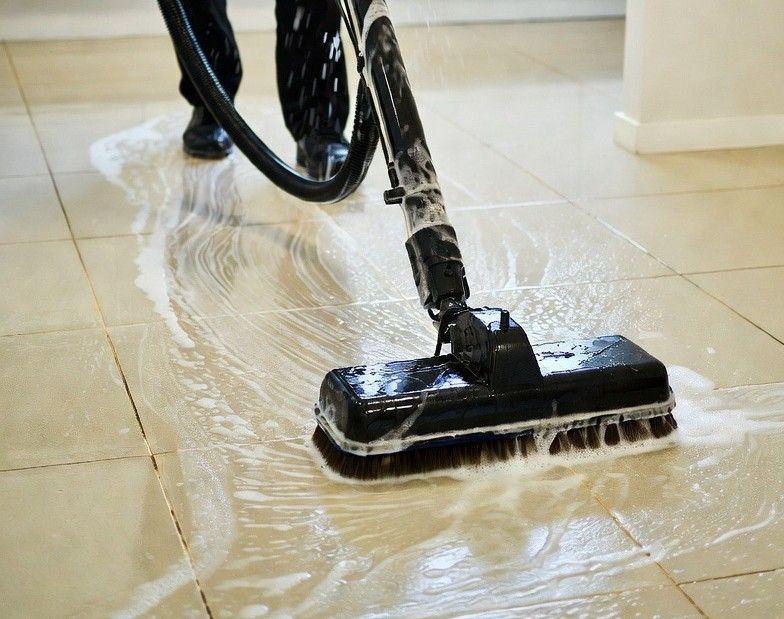 professional tile cleaning equipment in action on a kitchen floor